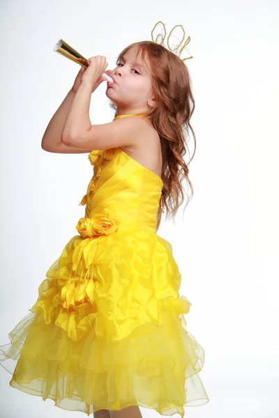 Little girl in a yellow dress and a crown — Stock Photo, Image