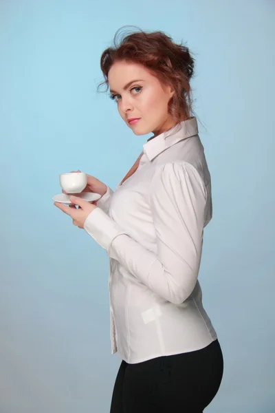 Woman drinking from a cup of coffee — Stock Photo, Image