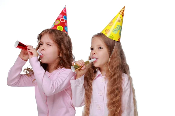 Two party girls blowing noisemakers — Stock Photo, Image