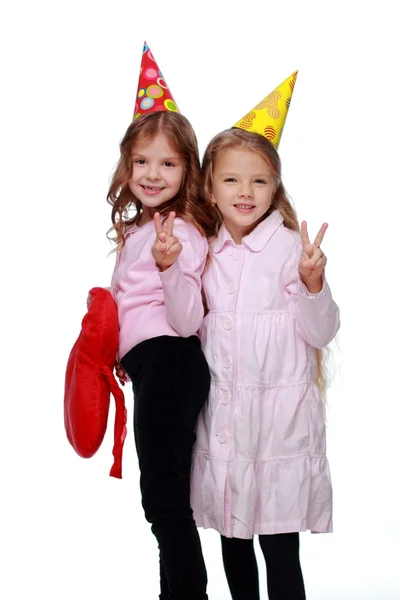 Party girls blowing noisemakers — Stock Photo, Image