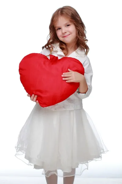 Little girl with a heart — Stock Photo, Image