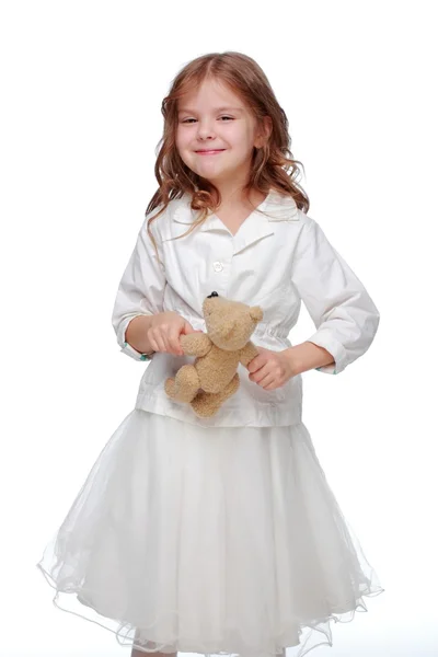 Meisje en een pluizige speelgoed — Stockfoto