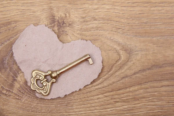 Metal key and the symbol of the heart — Stock Photo, Image