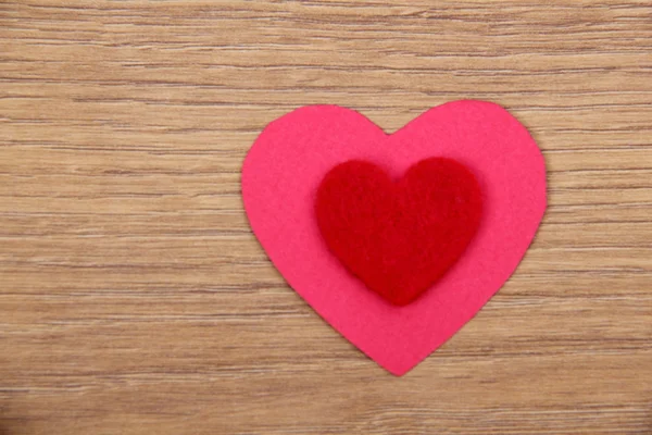 Heart symbol on a wooden background — Stock Photo, Image