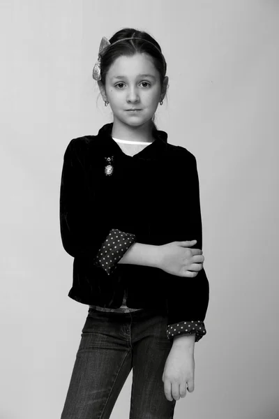 Black and white close-up portrait of smiling pretty little girl — Stock Photo, Image