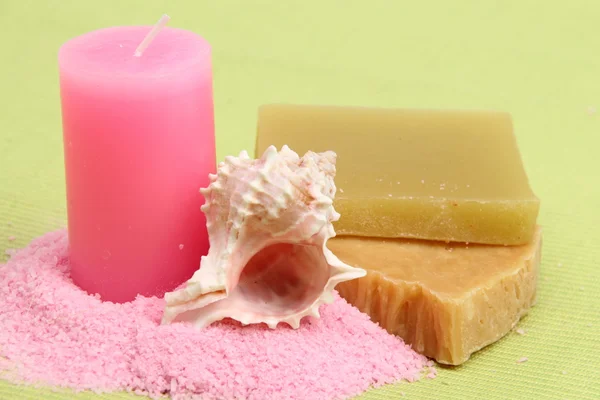Decoration of sea salt, spa soap, pink candle and beautiful sea shell — Stock Photo, Image