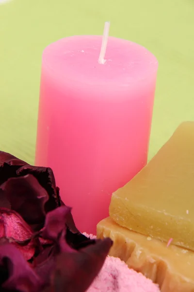 Decoration of sea salt, handmade soap, pink candle and flower — Stock Photo, Image