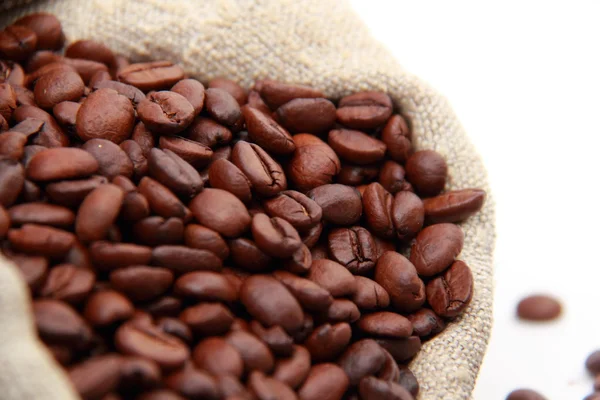 Coffee beans and sack close up — Stock Photo, Image