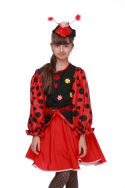 Happy young girl in a beautiful fancy dress ladybird on white background — Stock Photo, Image