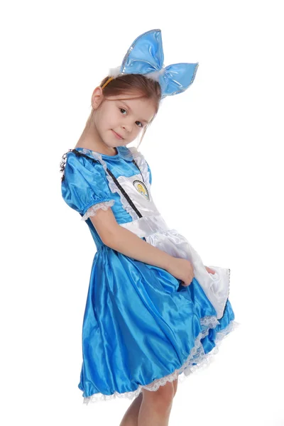 Schattig meisje in blauwe jurk op witte achtergrond — Stockfoto