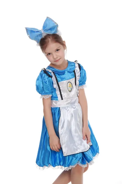 Adorabile bambina in abito blu su sfondo bianco — Foto Stock