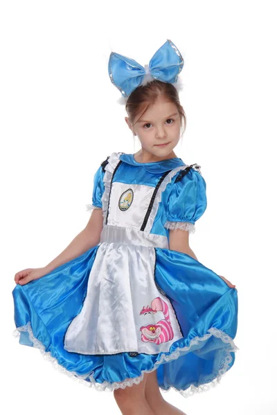 Rozkošná holčička v modrých šatech na bílém pozadí — Stock fotografie