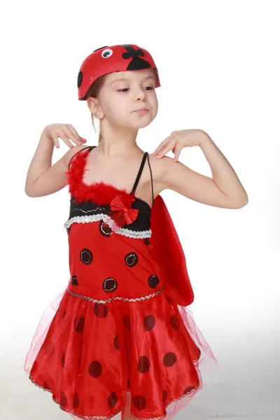 Cheerful little girl dressed in red costume with wings Ladybug — Stock Photo, Image