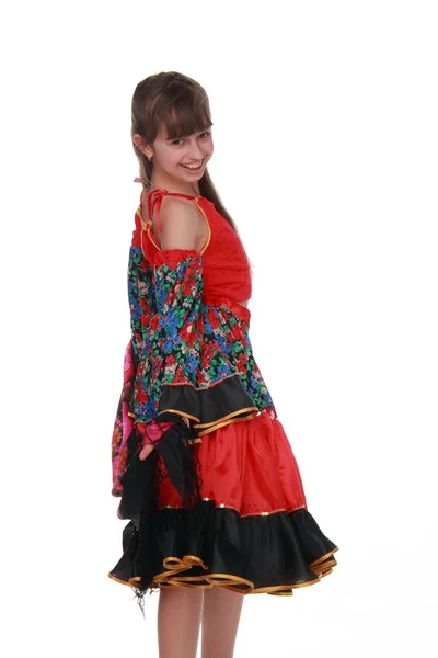 Krásná dívka v barevné šaty na bílém pozadí — Stock fotografie