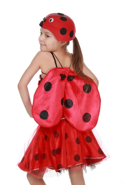 性格开朗的小女孩穿着红色服装与翅膀瓢虫 — 图库照片
