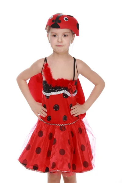 Wesoła dziewczynka ubrana w czerwony strój z skrzydła biedronka — Zdjęcie stockowe