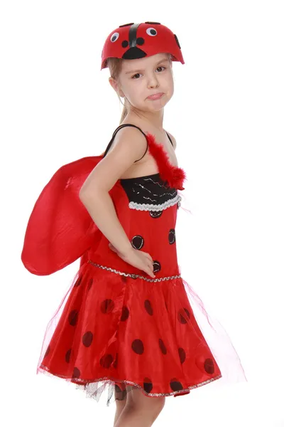 性格开朗的小女孩穿着红色服装与翅膀瓢虫 — 图库照片