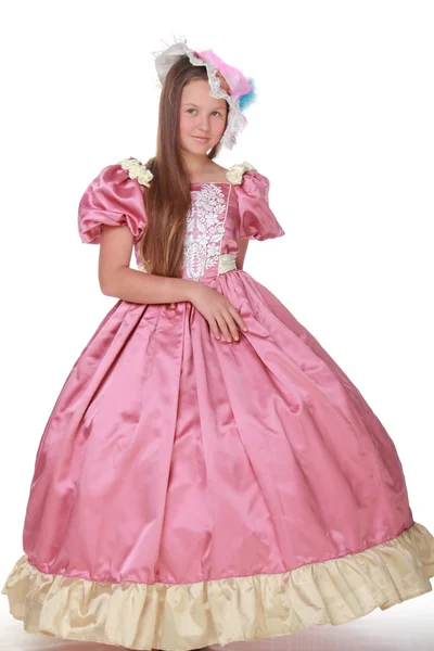 Девушка в прекрасной шляпе и пышном розовом платье — стоковое фото