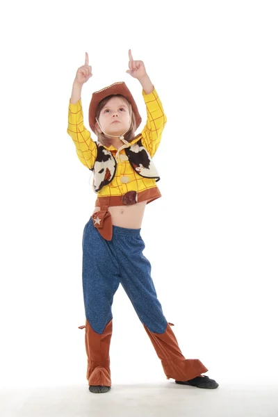 Belle petite fille en costume de cow-boy sur fond blanc — Photo