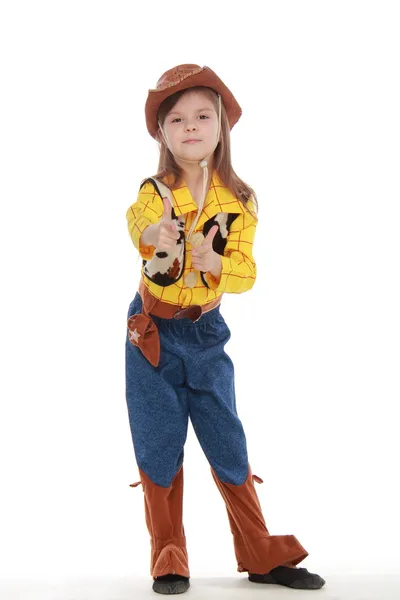 Hermosa niña en un disfraz de vaquero sobre fondo blanco — Foto de Stock