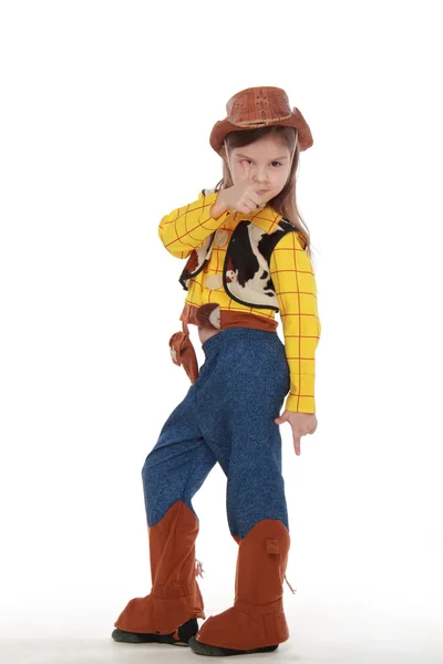 Belle petite fille en costume de cow-boy sur fond blanc — Photo