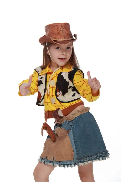 Menina bonita em um traje de cowboy no fundo branco — Fotografia de Stock