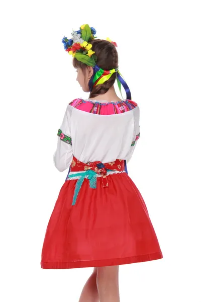 Flicka i blommor krans och traditionella kläder — Stockfoto