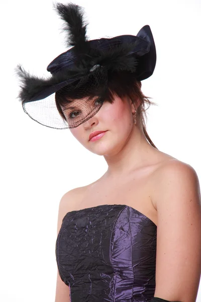 Docela pin-up girl v krásné šaty s kloboukem — Stock fotografie