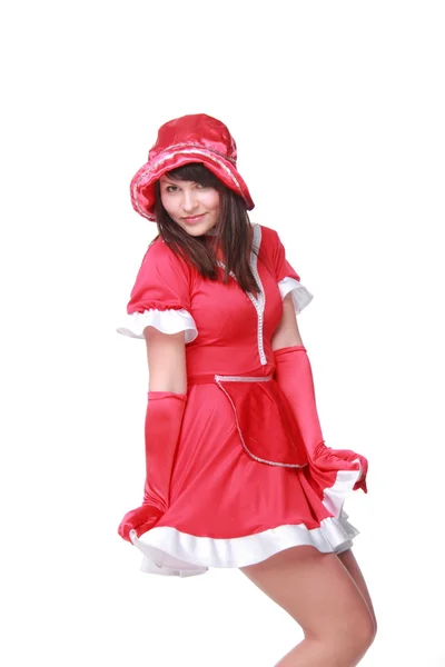 Ung kvinna i en röd klänning och röda hatt — Stockfoto