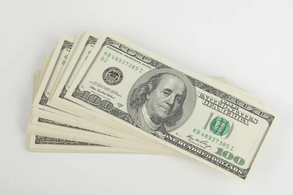 Доллары США на белом фоне — стоковое фото