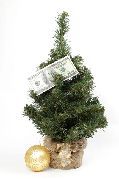 Juguete de Navidad y árbol de Navidad decorado con billete de dólar Fotos de stock libres de derechos