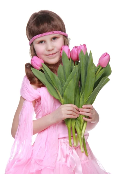 Little girl with a big bouquet on white background on Holiday. — Stock Photo, Image