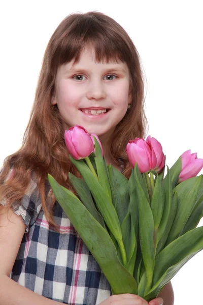 Portrait of a charming young girl with beautiful hair holds a beautiful fresh tulips for Easter — Stock Photo, Image