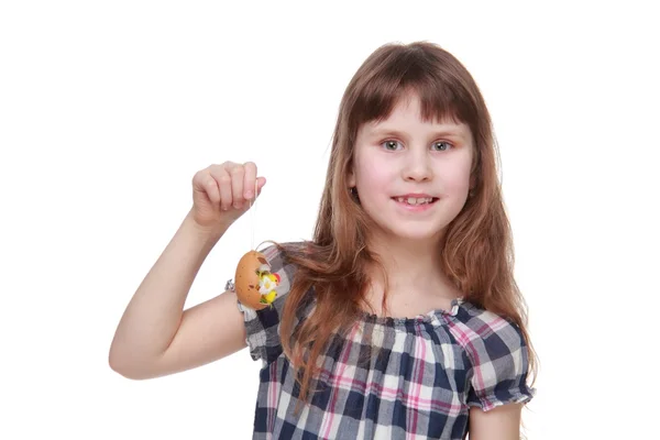 Pretty little girl holding a chicken egg for Easter — Stock Photo, Image