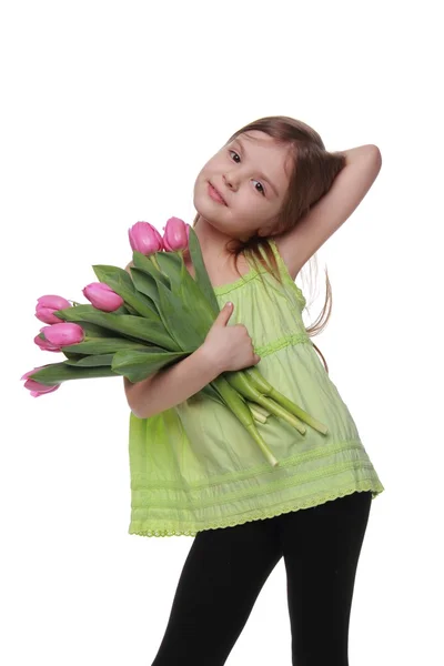 Happy little girl with a big bouquet of tulips — Stock Photo, Image