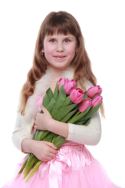 Hermosa bailarina bailando ballet con tulipanes sobre fondo blanco — Foto de Stock