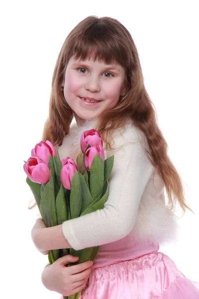 Menina com tulipas no fundo branco — Fotografia de Stock
