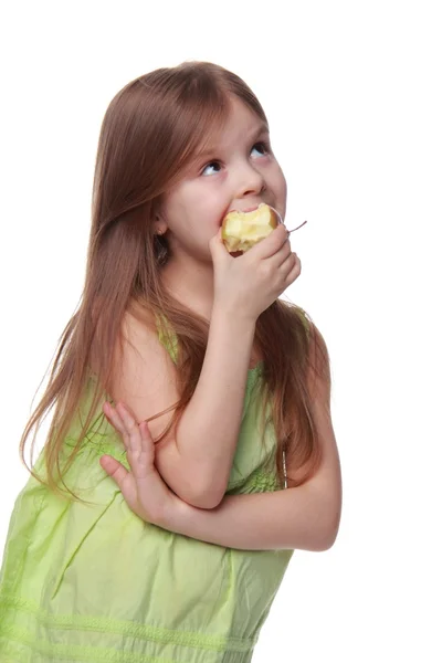 Portrait of a beautiful little girl eating an apple — Stock Photo, Image