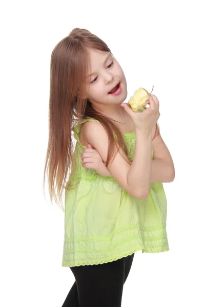 Portrait of a beautiful little girl eating an apple — Stock Photo, Image