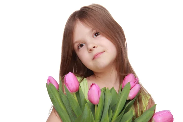 Beautiful little girl with a bouquet of tulips — Stock Photo, Image