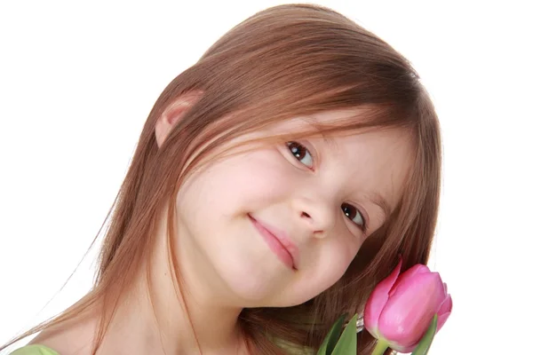 Portret van een mooi meisje met een tulp — Stockfoto