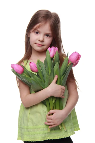 Hermosa niña con un gran ramo de tulipanes — Foto de Stock