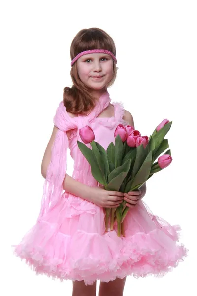 Little princess in a dress with a bouquet of tulips — Stock Photo, Image