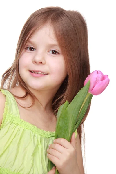 Portrait of a cute little girl with tulip — Stock Photo, Image