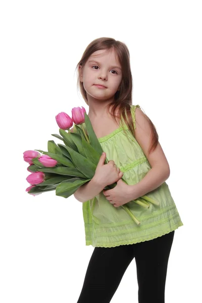 Afbeelding van een prachtig kind met een boeket van tulpen — Stockfoto