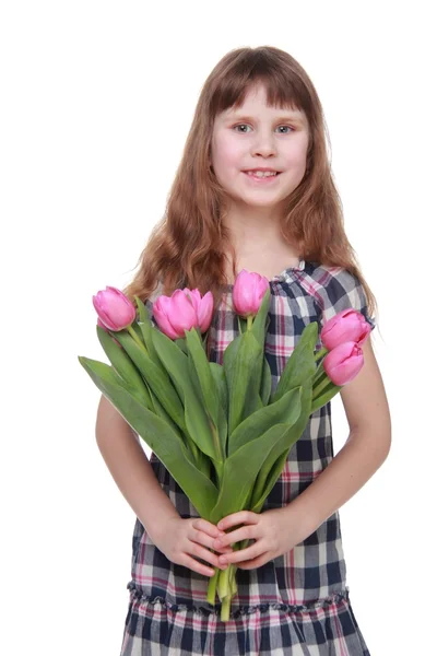 Portrait of a little girl with a big bouquet of tulips — Stock Photo, Image