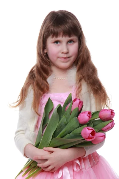 Pequena princesa em um vestido com um buquê de tulipas — Fotografia de Stock