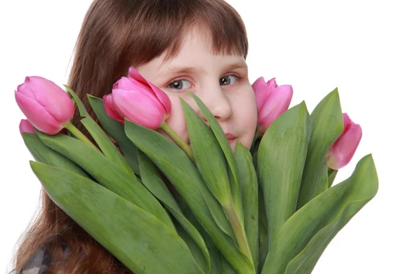 Portrait of a little girl with a bouquet of tulips — Stock Photo, Image