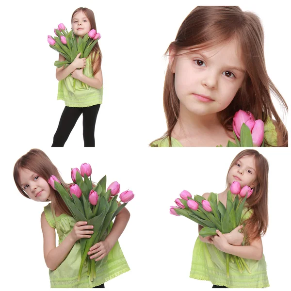 Schattig klein meisje met tulpen — Stockfoto