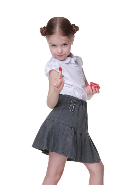 Portait of a schoolgirl posing with red paint — Stock Photo, Image